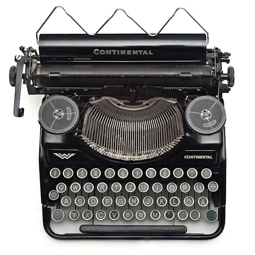 Free Black Continental Typewriter on White Surface Stock Photo