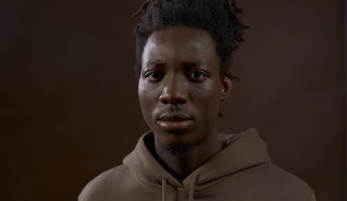 A Man in Brown Hoodie