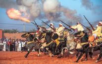 Men on Horseback Shooting Guns 