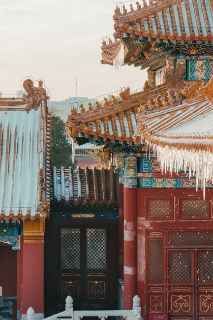 Intricate architecture of the Forbidden City with icicles in winter, Beijing, China.