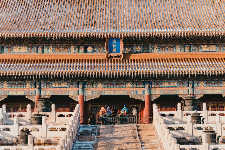 Group Of People Visiting Chinese Ancient Building In Winter