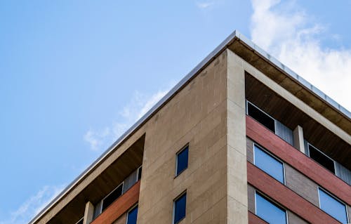 Free Low Angle Photography of Brown Concrete Building Stock Photo