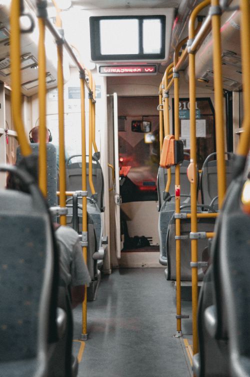 Free View of empty public bus interior showcasing seating and handrails in Sevastopol. Stock Photo