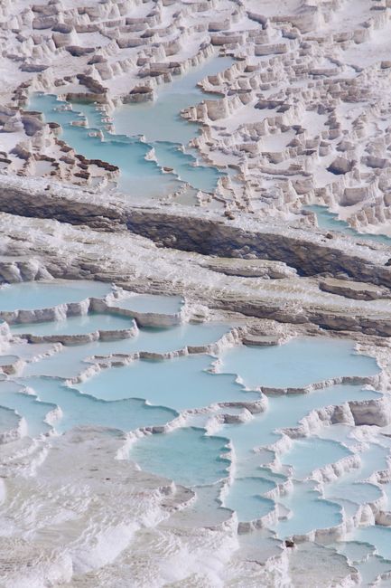 A breathtaking aerial shot of the famous travertine terraces in Pamukkale, Türkiye.