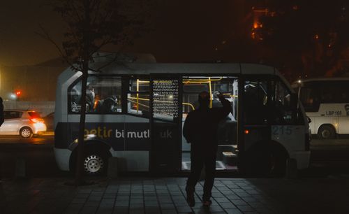 Free Silhouette of a person entering a bus at night in Istanbul's public transportation system. Stock Photo