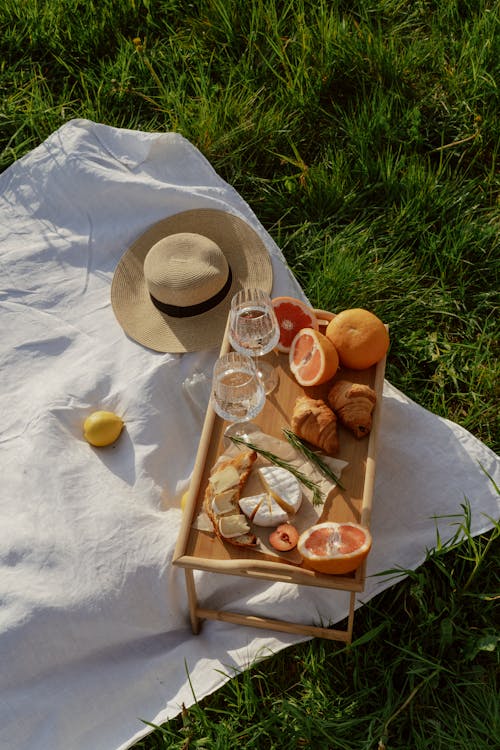 Picnic Table with Food on Blanket