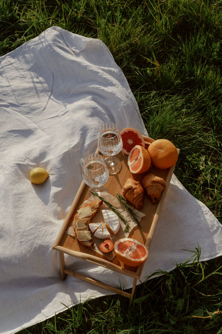 Picnic Table With Food On Blanket