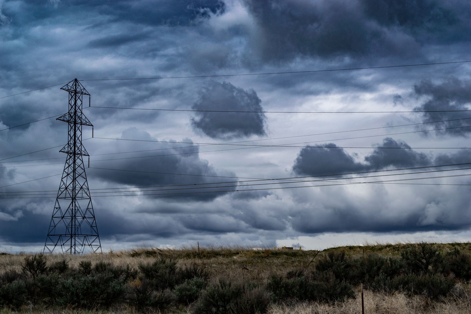 Power tower under dramatic American storm clouds
