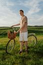 Man Holding Bicycle with Products for Picnic