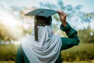 Person in Blue Academic Dress
