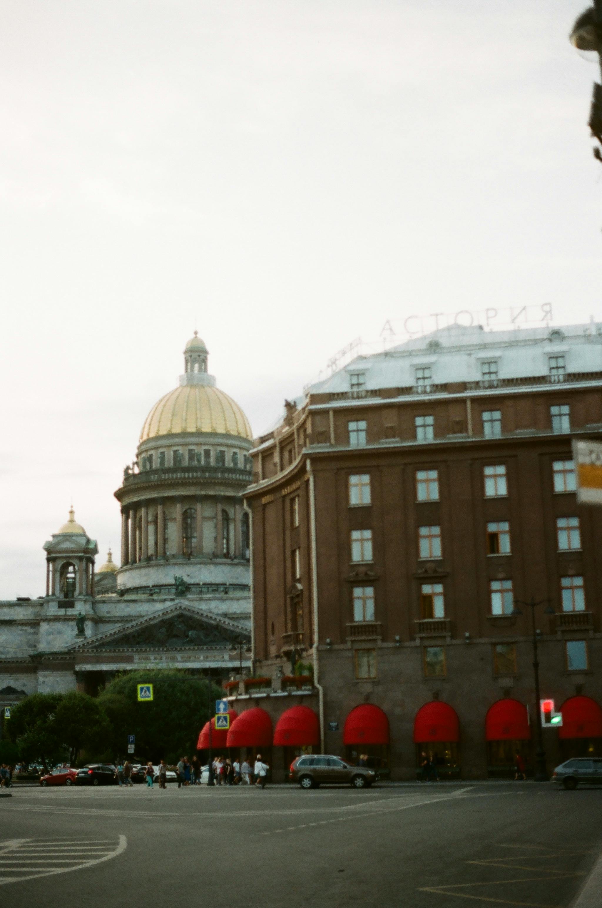 View of St. Isaac's Cathedral and urban street in Saint Petersburg, Russia.