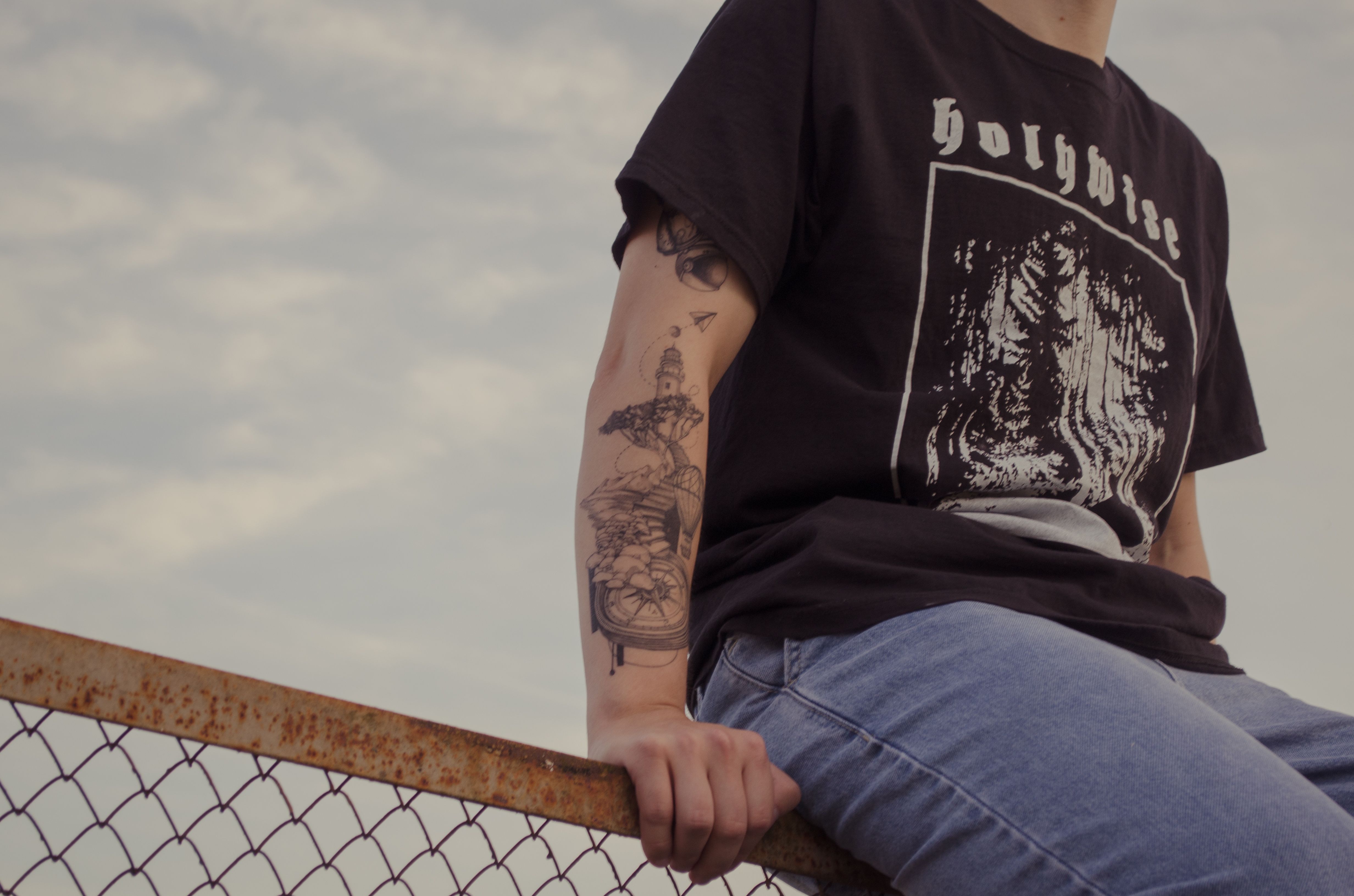 Wearing Black T-Shirt and Denim Jeans 