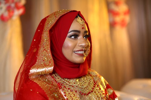 Woman Wearing a Red Dress Smiling