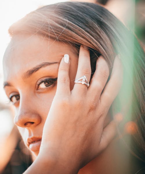 Beautiful Woman with Hand on Cheek