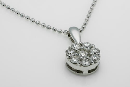 Close-Up Photograph of a Pendant with Diamonds