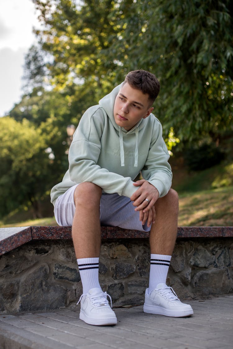 Teenage Boy In Green Hoodie