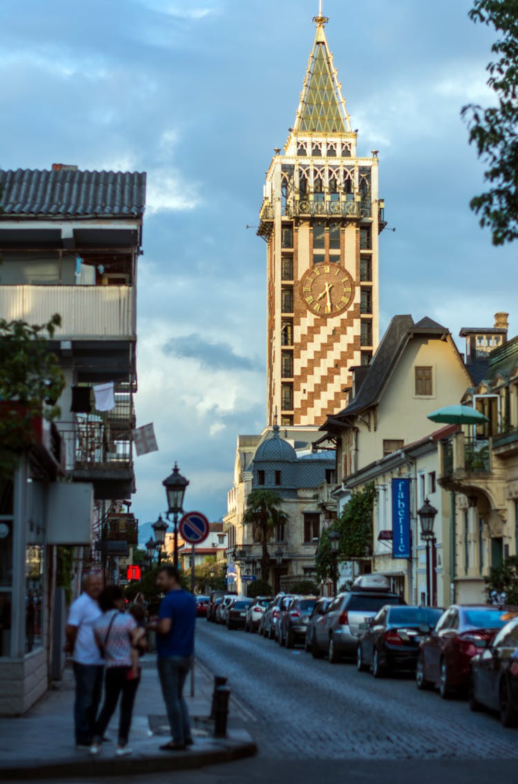 .Lines Of Car On The Street Bear The Clock Tower