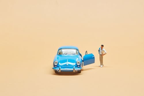 Miniature Car and a Human Figurine