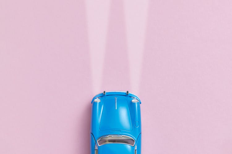 Overhead Shot Of A Blue Toy Car