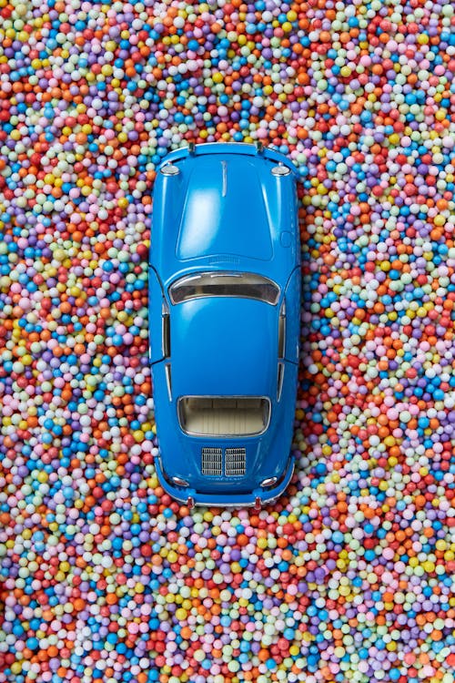 A Blue Toy Car on Colorful Beads