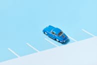 A Blue Toy Car on Blue Surface