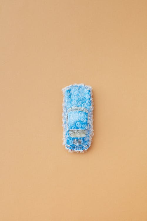 Blue Toy Car Covered with Bubble Wrap