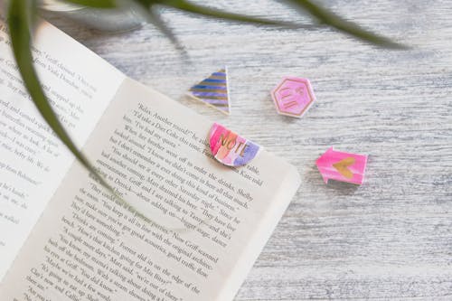 Free Opened Book With Pink Note Bookmark Stock Photo
