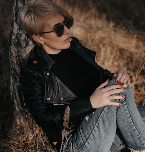 Woman in a Black Leather Jacket Wearing Black Sunglasses