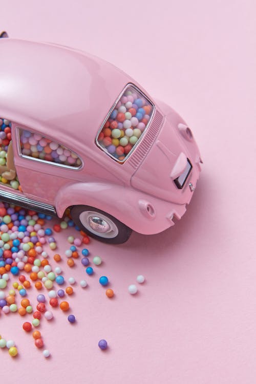 Pink Toy Car on Pink Background