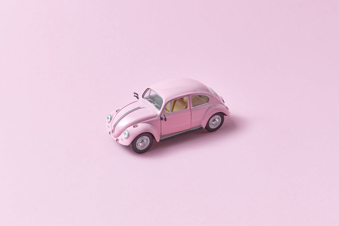 Pink Toy Car on Pink Background