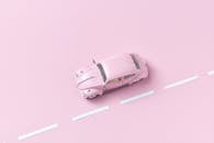 Pink Toy Car on Pink Background