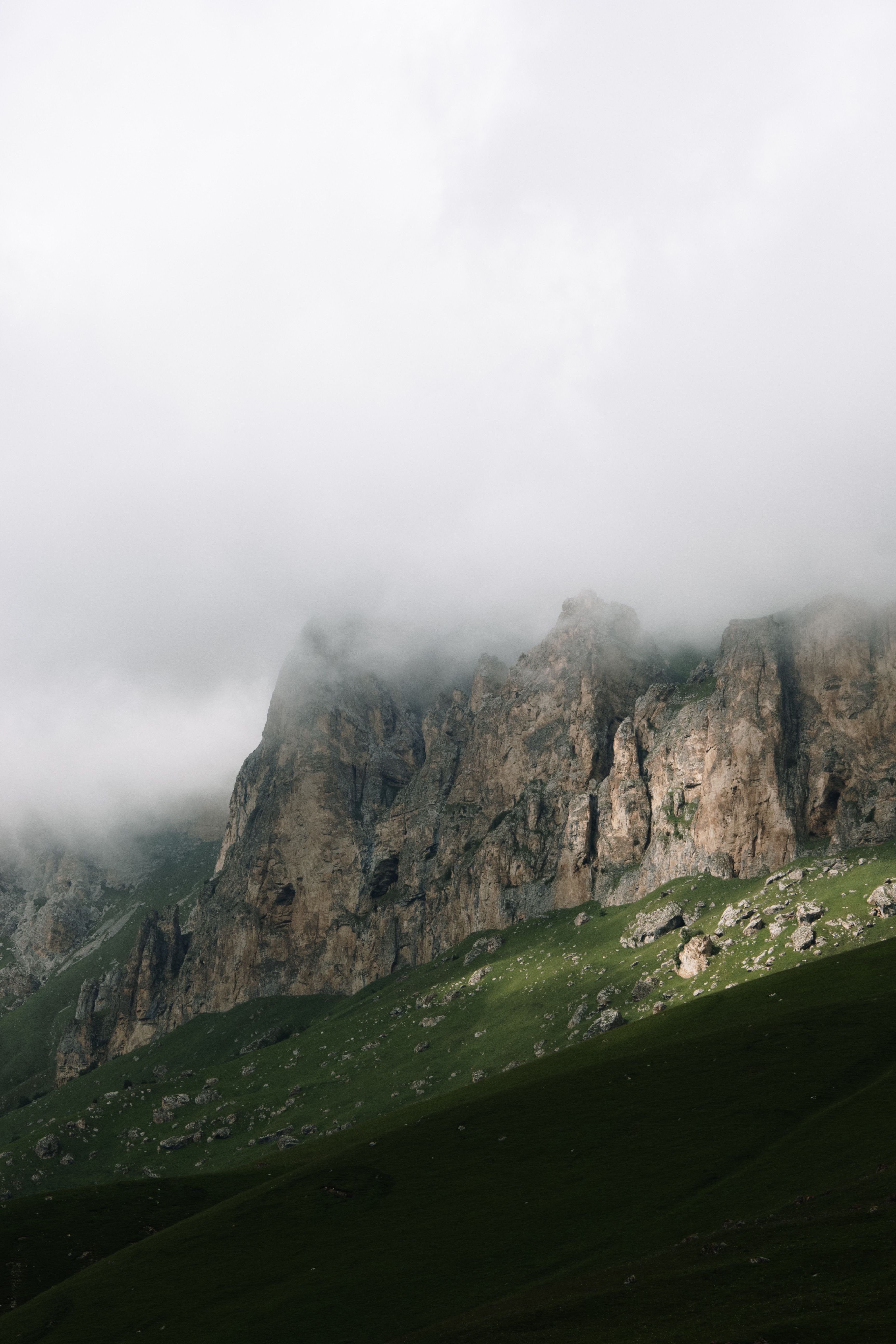 Rocky Mountain Covered with White Clouds · Free Stock Photo