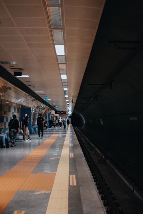 Free Bustling İstanbul metro station with commuters walking along the platform. Stock Photo