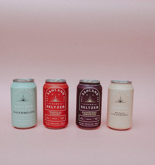 Free Beer in Can on Pink Background Stock Photo