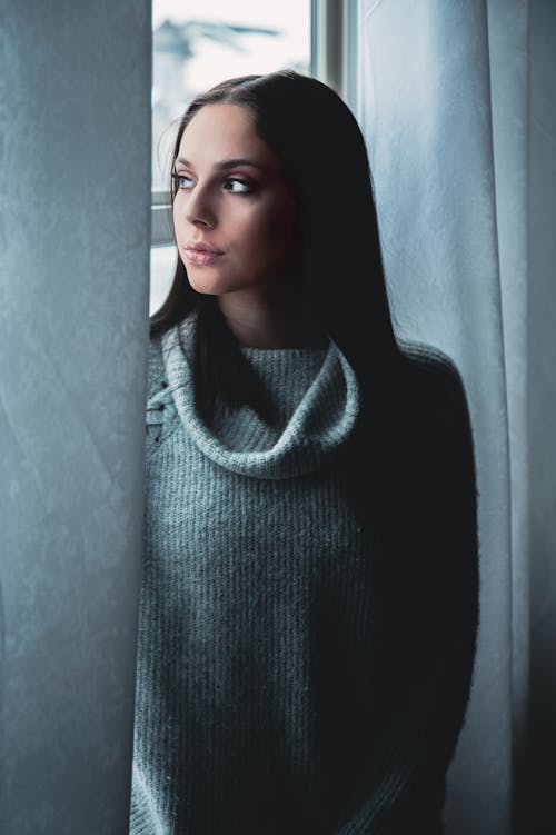 A Woman in Gray Turtleneck Sweater