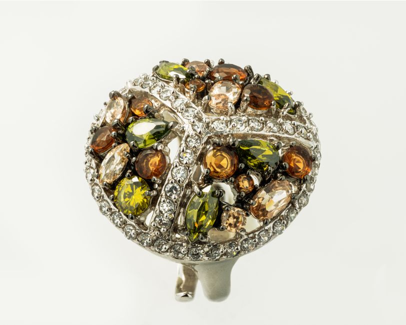 A silver ring with sparkling multicoloured gemstones A silver ring with sparkling multicoloured gemstones