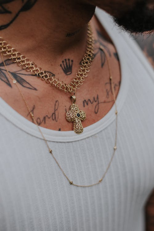 Person Wearing Gold Necklaces