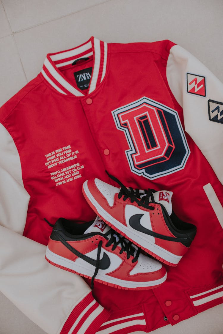 Red And White Varsity Jacket And Nike Air Jordan Shoes