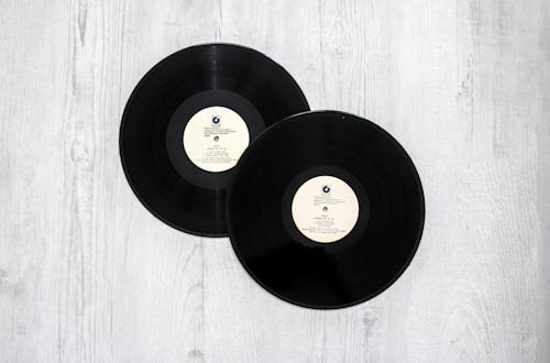 Free Photography of Vinyl Records On Wooden Surace Stock Photo