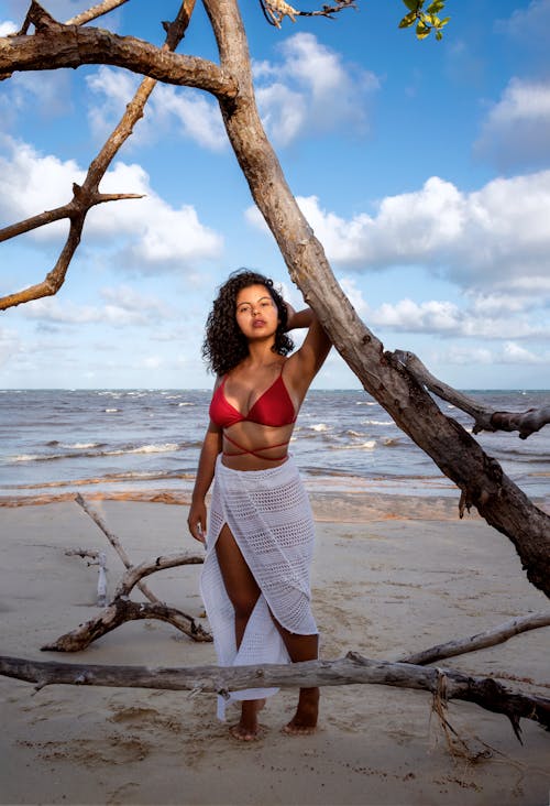 Free Woman in Red Brassiere Standing at the Beach Stock Photo