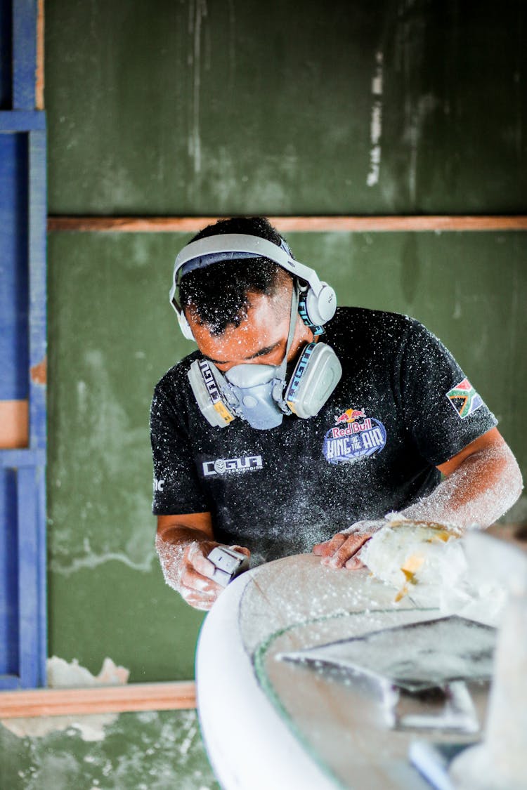 Man Working With Mask And Headphones