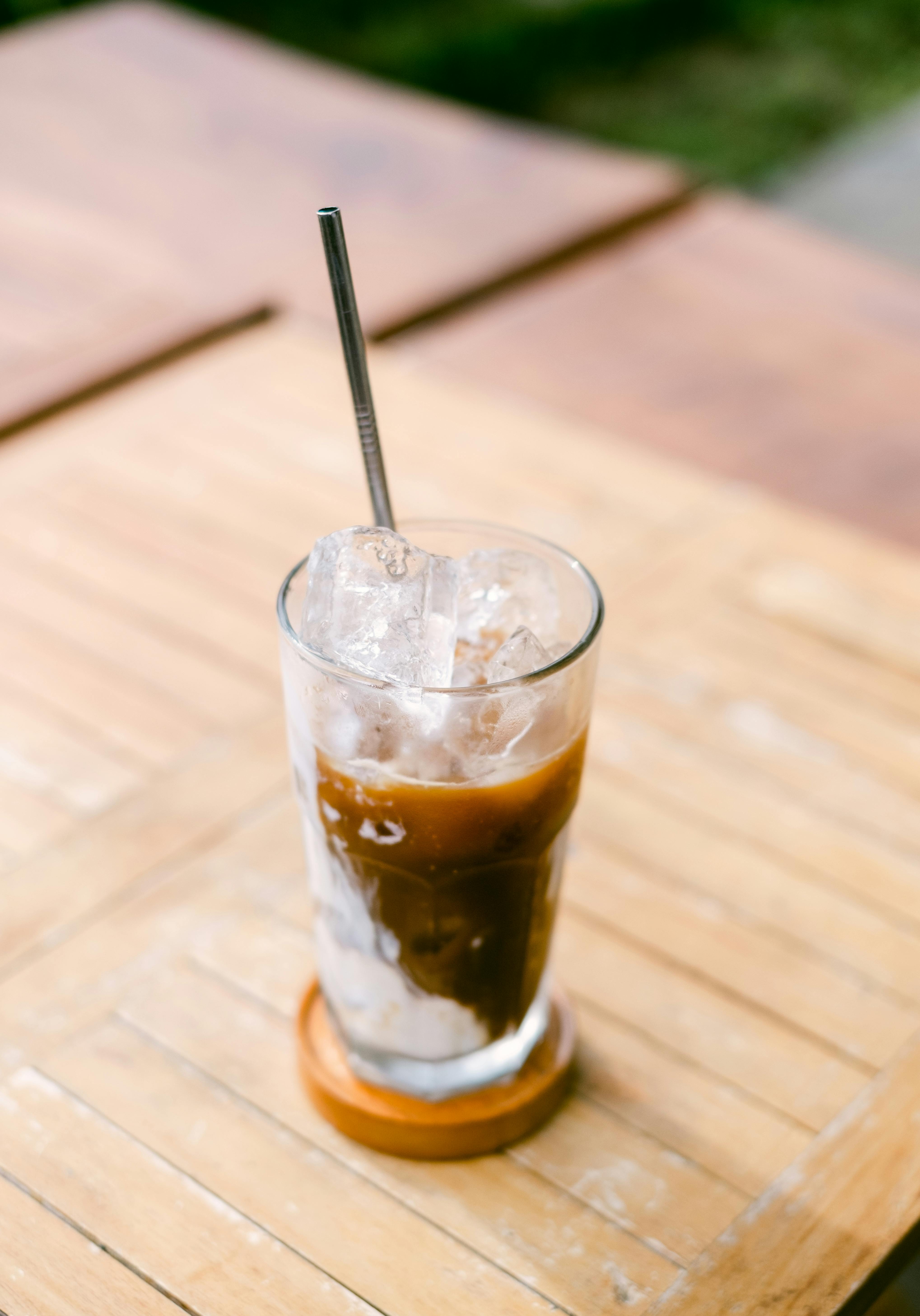 Iced Coffee In Mug On Wooden Table, With Shade On Floor Stock Photo,  Picture and Royalty Free Image. Image 60320258.