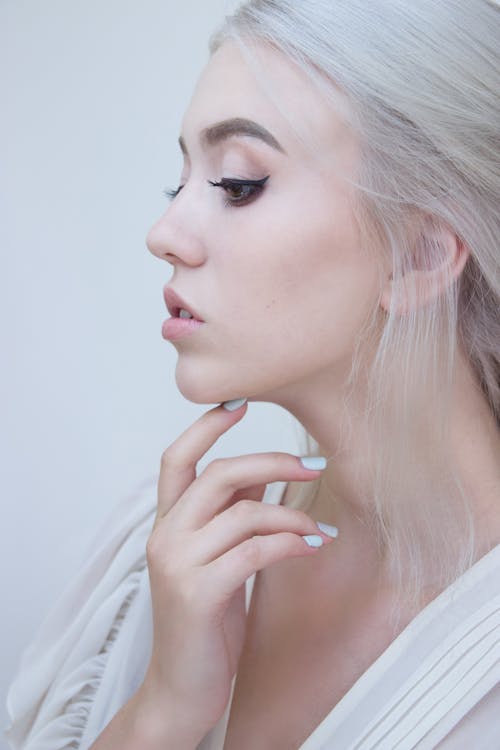 Girl with White Hair Touching Face