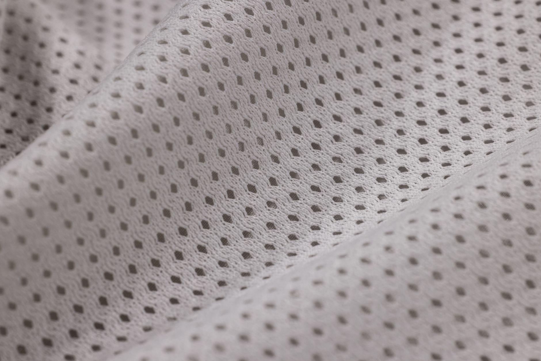 Three t-shirt fabric swatches showing visible density differences from lightweight to heavyweight GSM