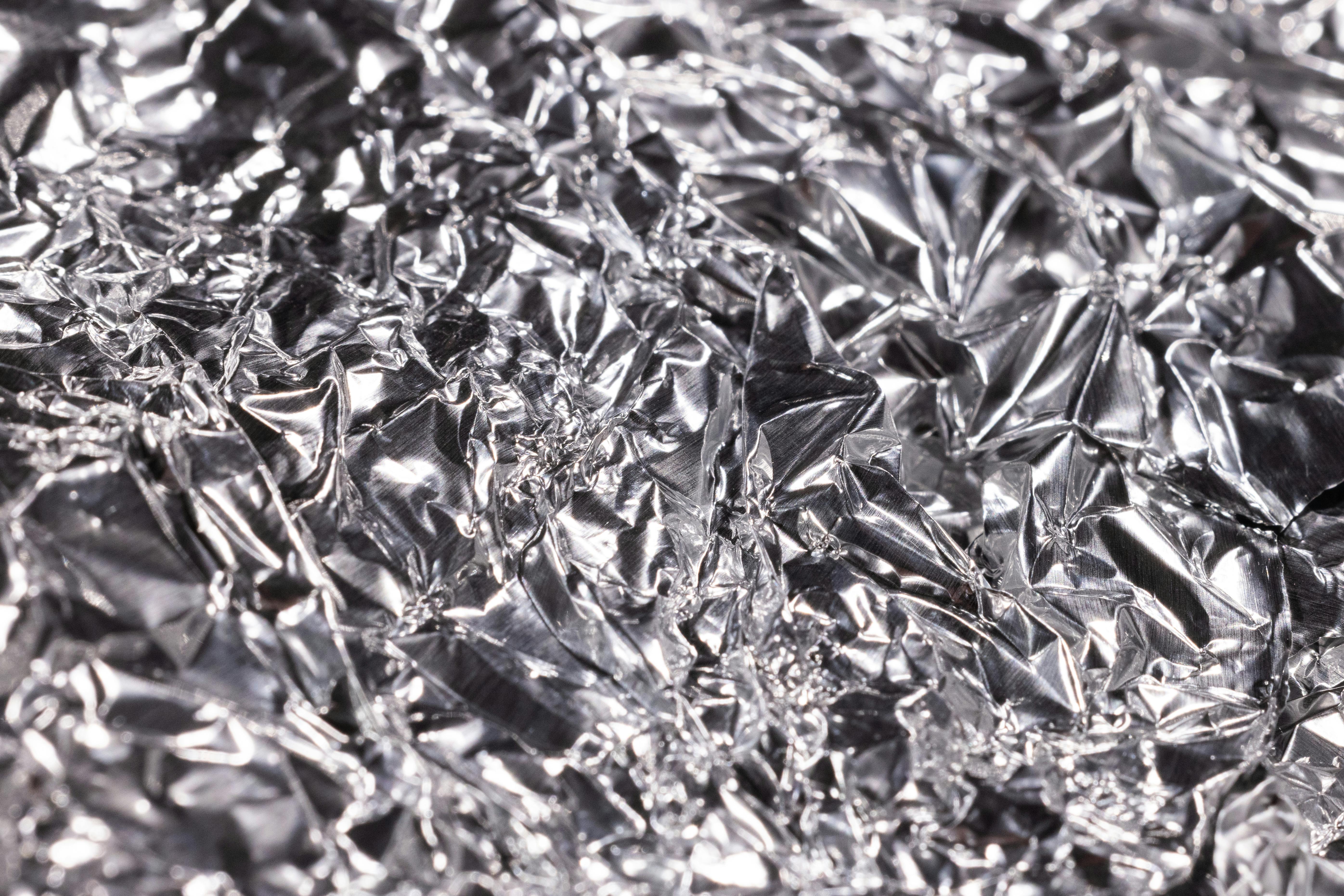 a close up shot of a crumpled aluminum foil