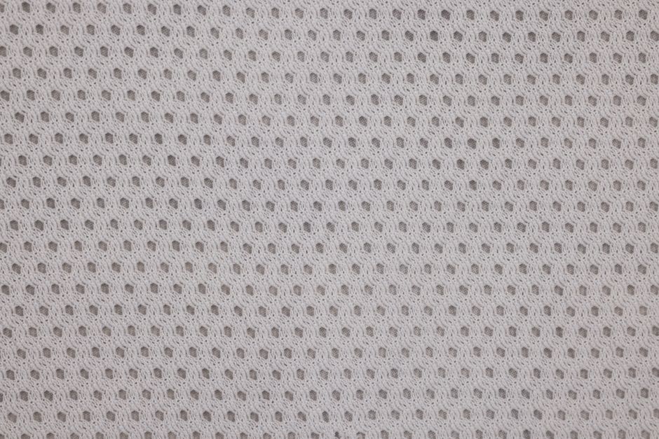 Close-up of perforated overgrip texture for sweat management - pickleball paddle overgrip Close-up of perforated overgrip texture for sweat management - pickleball paddle overgrip