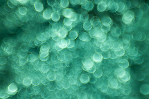 Free Abstract green bokeh texture perfect for backgrounds, creative projects, and design elements. Stock Photo