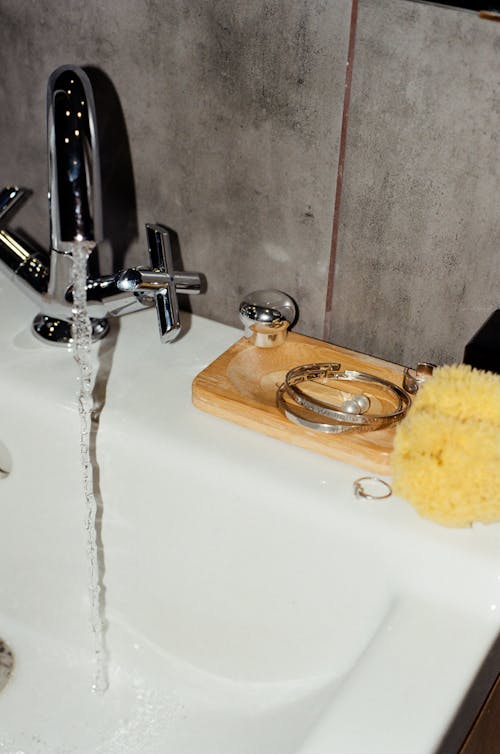 Free Stainless Faucet on a Sink Stock Photo