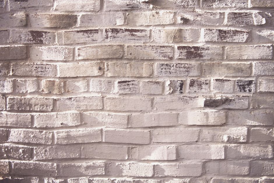 High-quality image of a rugged white brick wall, ideal for backgrounds.