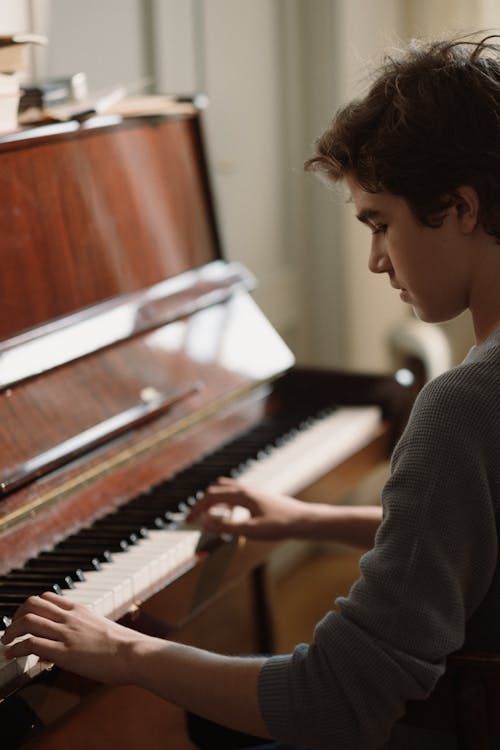 Young Pianist Playing a Piano